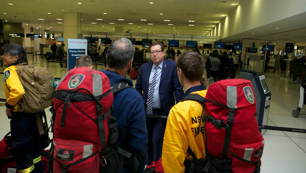 Minister Grant farewells RFS firefighters heading to Canada.