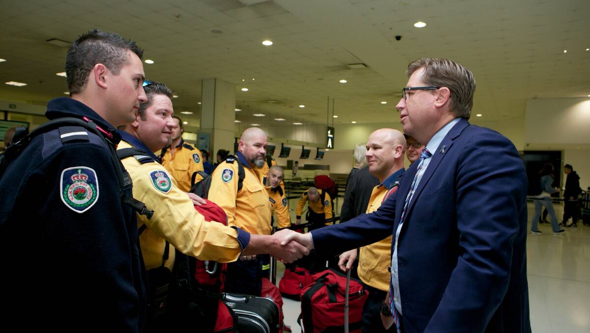 Minister Grant farewells RFS firefighters heading to Canada.