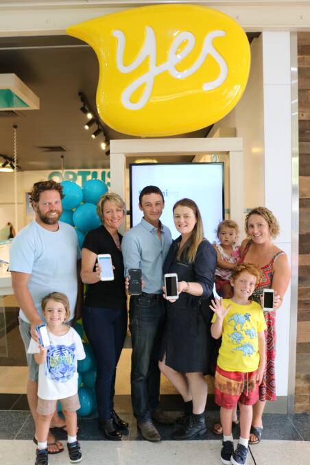 Kooreil Lester, Kim Shirono, Mat and Emma Brisby, Meeka Lester and Amy Jones with (front) Tarrin Lester and Murribi Lester.  Mat and Emma are the franchisees of the Optus Taree and Forster stores.
 