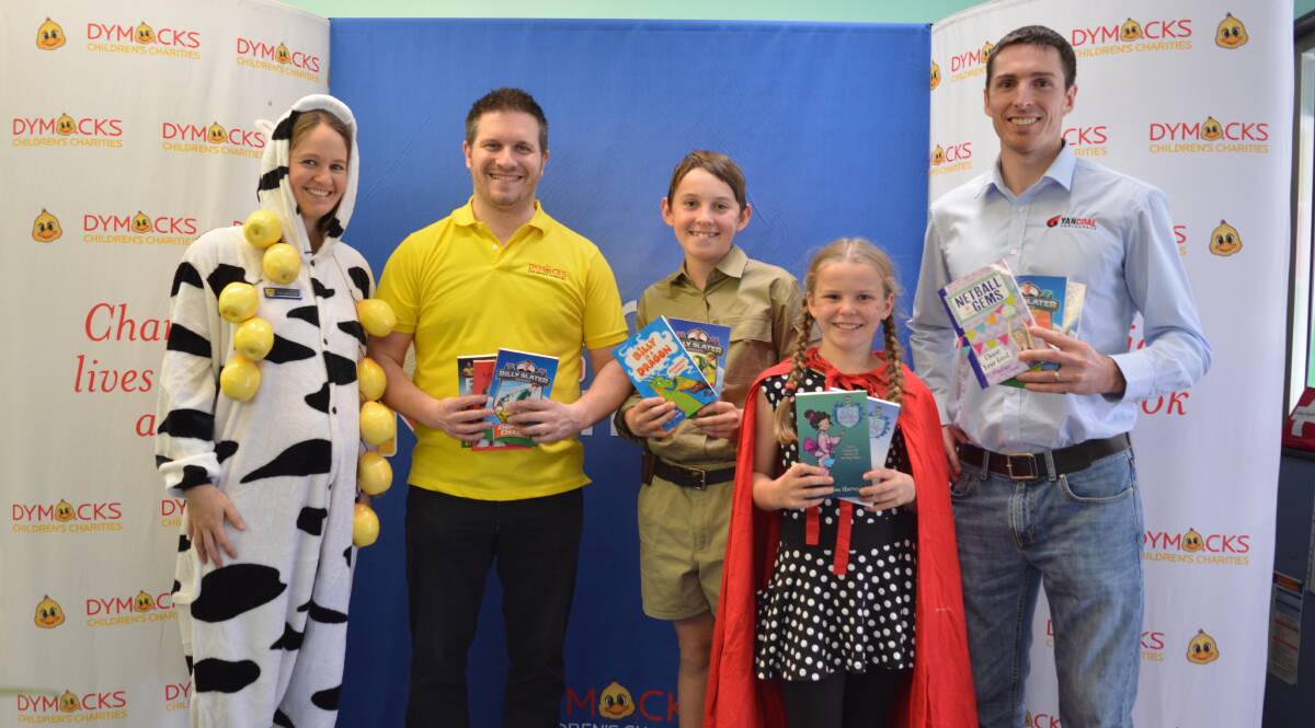 Hayley Laurie, Paul Swan, Bailey Hughes, Brooke Willis and Micheal Plain show off some of the books received by the school library. 