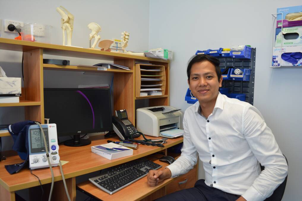 Getting comfortable: Dr Joshua Thant has made himself at home in his new office at the Gloucester MediCo Centre. Picture: Anne Keen