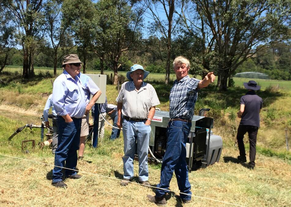 Dairy farmer John Hooke explaining his new system to Joe Thompson from Hunter Local land Services and fellow dairy farmer Ken Fisher from Salisbury. Photo. Supplied