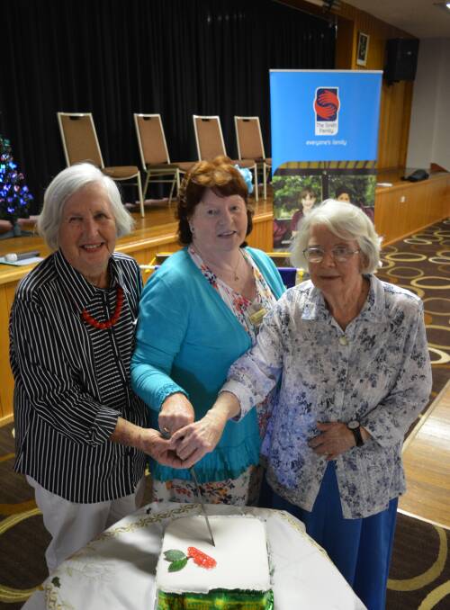 Cutting the cake:  Joyce Buswell, Lynette Hebblewhite and Jean Baumann have the honour of cutting the cake for dessert.