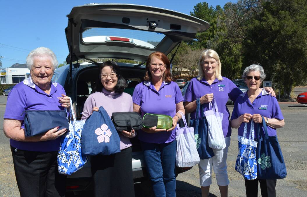 Survival packs: Margaret Andrews, Li Men Wong, Val Pritchard, Pamela Stewart and Helen Parsons getting the bags ready to transport. Photo: Anne Keen