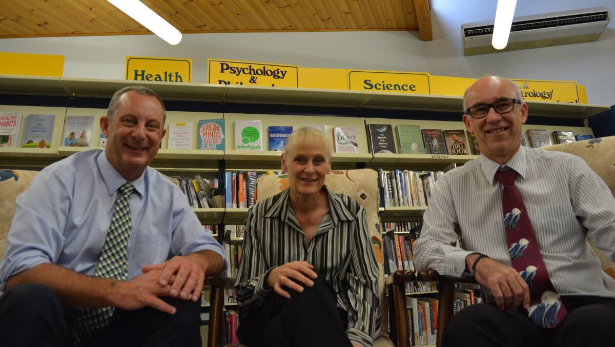 Comfortable space: Michael Johnsen, library officer, Cathy Devereux and Chris Jones test out the concept of a community living room.