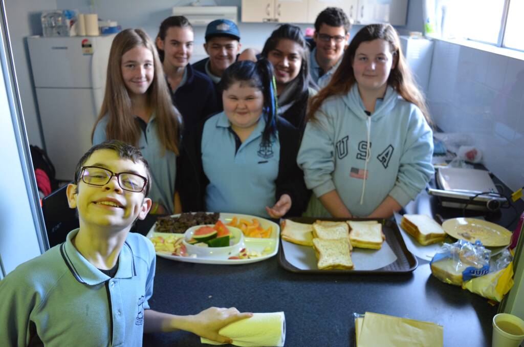 Open to everyone: Gloucester High School students enjoy the toasted sandwiches and hot drinks in the school hall. Photo: Anne Keen