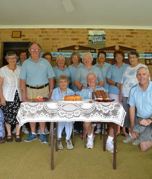 Hip Hip Hooray: Leah and Colin Weismantel sit surrounded by their fellow croquet club members during the celebration on Monday morning at the clubhouse. Picture: Anne Keen 