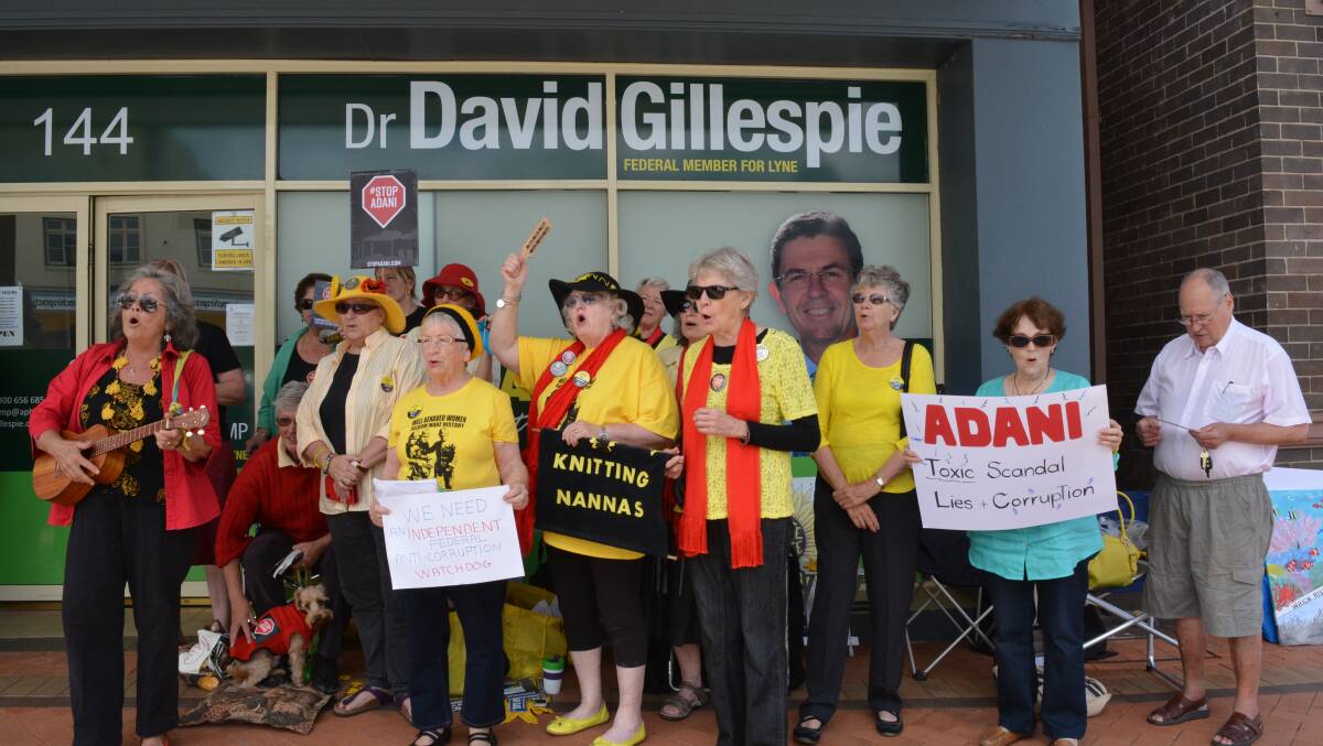 Knitting Nannas singing out front of David Gillespie's Taree office in protest of the Adani mine. Photo Anne Keen  