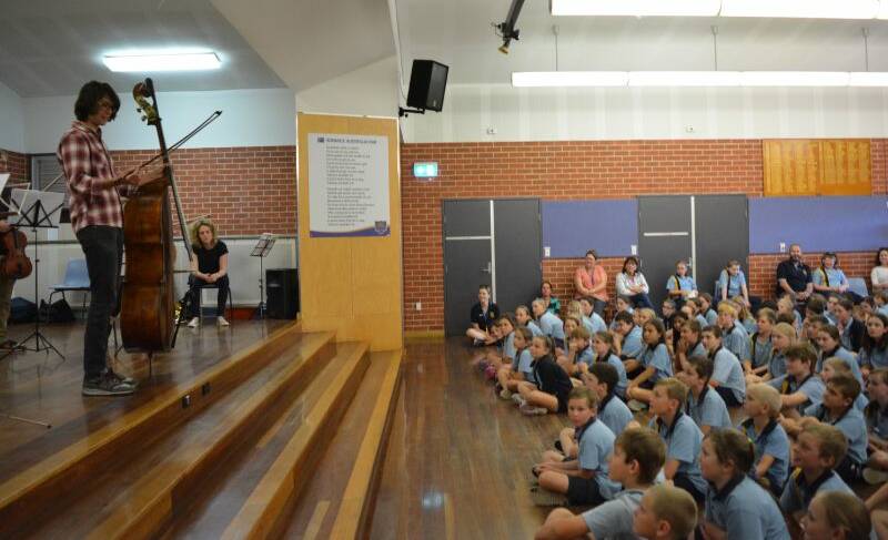 Elephant in the room: Gloucester Public School students hear a song written to make the double bass sound like an elephant. Picture: Anne Keen 