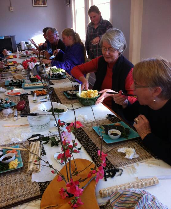 The art of food: The Gloucester Art Society enjoy a Japan inspired day of food and painting during their recent meeting. Picture: Supplied