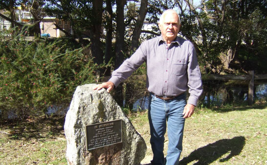 In memoriam: Bob Clarke said if the crash had occurred 100 metres to the north, it would have landed on Grahame’s Garage, which can be seen behind the memorial plaque in Billabong Park. Picture: Supplied