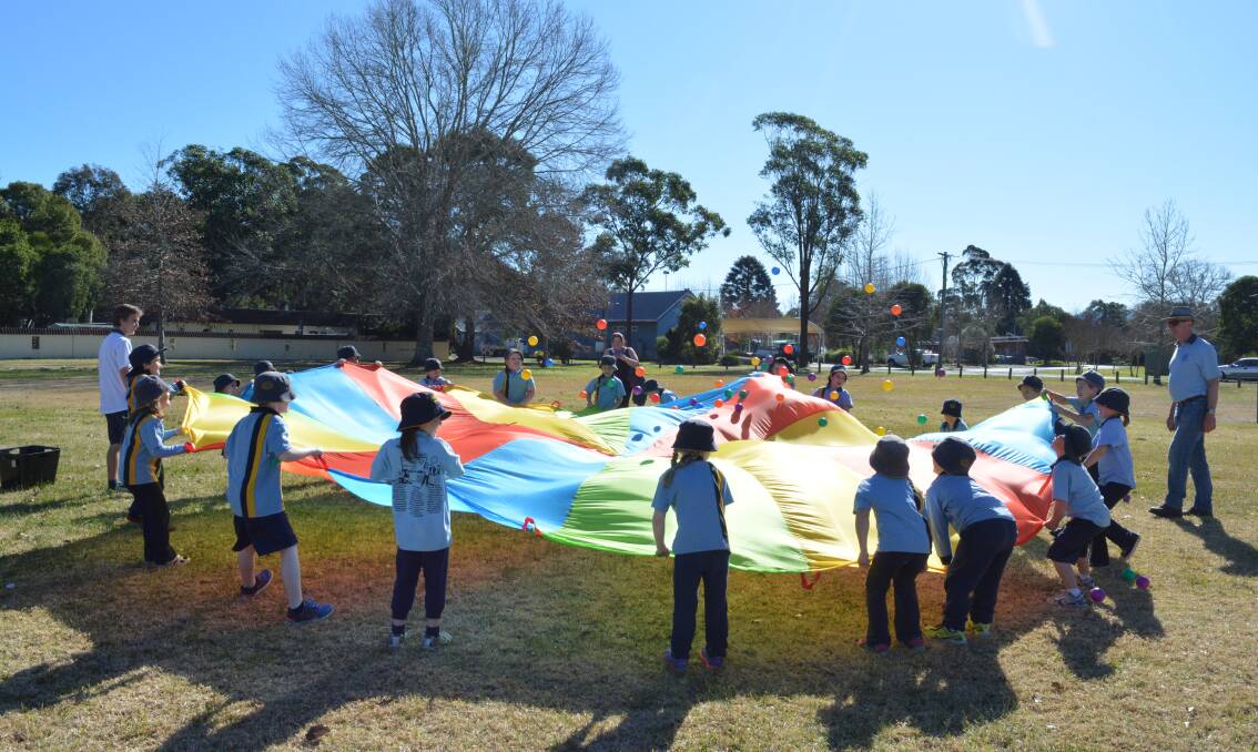 Gloucester Public School students enjoy parachute games as part of the activities during their athletics carnival.