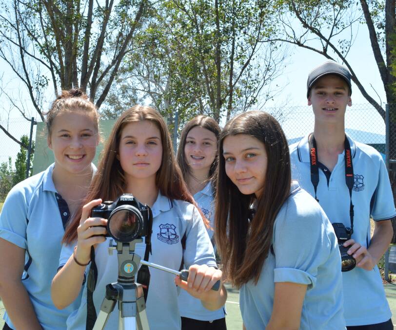 Budding filmmakers: Ayrleah Tull, Emily Murray, Kenndi Fraser, Tyler Cook and Hamish McClure filming at Barrington Public School. Picture: Anne Keen