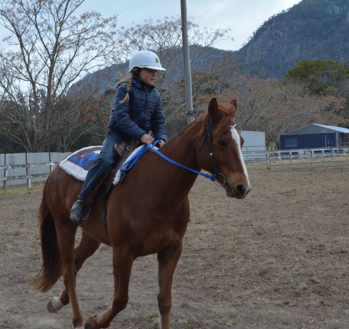 Learning the course: Ellie Bird learns how to guide a beast around the set course for the campdrafting event during day three of the youth clinic at the Gloucester Showgrounds. Picture: Anne Keen