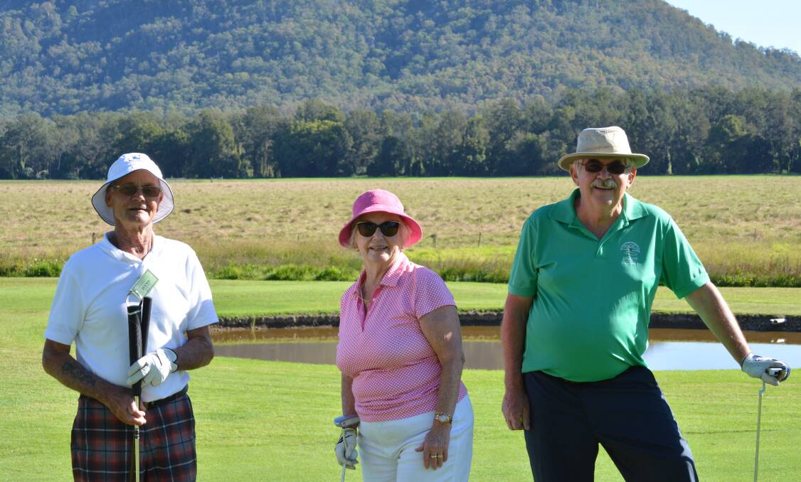 Taking a break: Hans Kaluski (Nelson Bay), ex-Gloucester resident Judy Rowe (Avondale) and Peter Buettel (Gloucester) stop for a quick photo between holes.