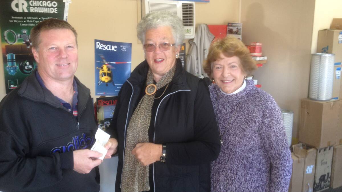 Gloucester Garden Club treasurer Robyn Henderson and President Shirley Hazell presenting a $250 cheque to Brian Clarke, president of the Westpac Helicopter Support Group.