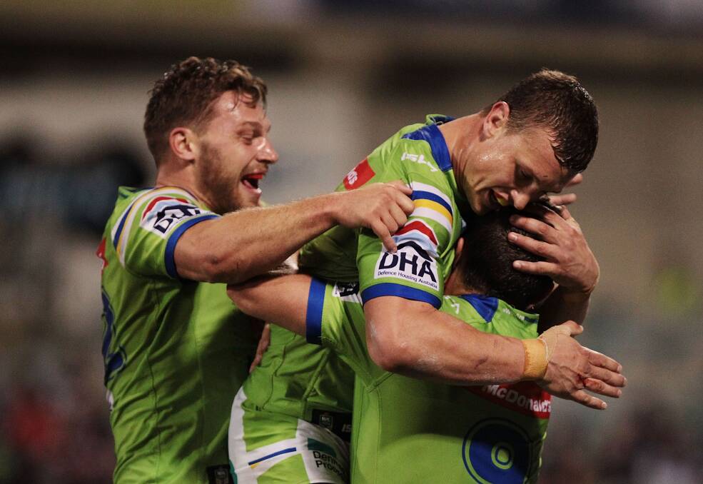 RAMPAGING: Josh Hodgson of the Raiders is congratulated after scoring a try during the round 13 NRL match between the Canberra Raiders and the Manly Sea Eagles. (Photo by Stefan Postles/Getty Images)