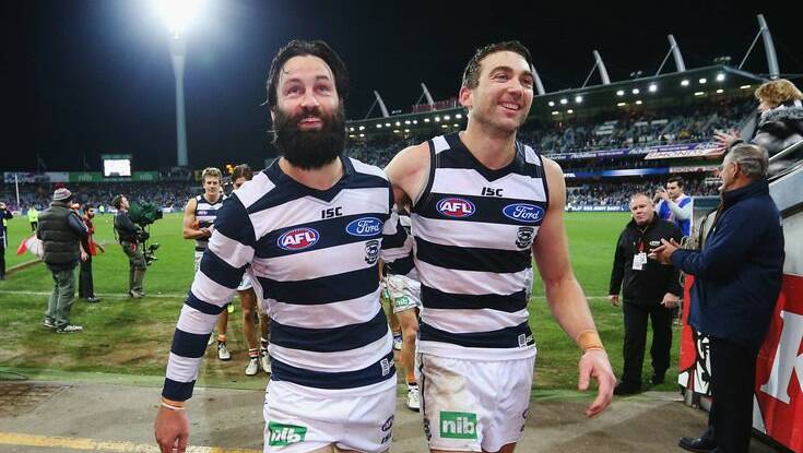 Geelong's Jimmy Bartel and Corey Enright celebrated their game milestones with a 25-point win over the Western Bulldogs at Simonds Stadium on Friday night. Pictures: Getty Images