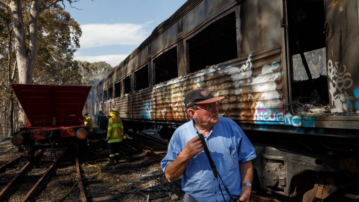 DEVASTATED: Peter Meddows, chairman of the Richmond Vale Railway Museum, surveys the charred remains of a carriage. Picture: Max Mason-Hubers