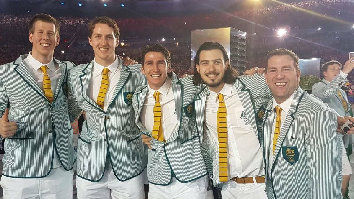 Damian Martin (centre) with his team mates during the opening ceremony.