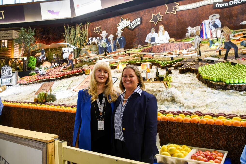 The winning Central District display with designer Kristine Moore and Central District president Alison Kernahan. Picture Elka Devney/The Land.