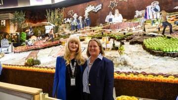 The winning Central District display with designer Kristine Moore and Central District president Alison Kernahan. Picture Elka Devney/The Land.