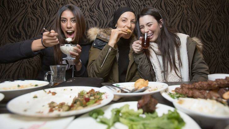 Becky, Adala and Jasmine enjoy iftar. Photo: Cole Bennetts