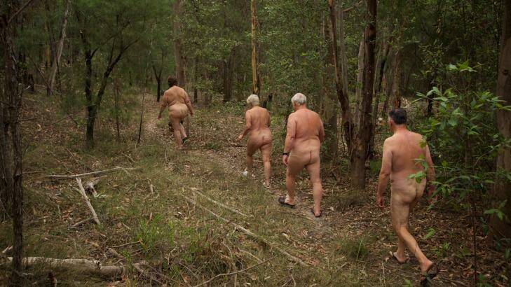 Members of the Campbelltown Heritage Nudist Club take a nature walk au naturel on their property at Minto Heights. Photo: Wolter Peeters