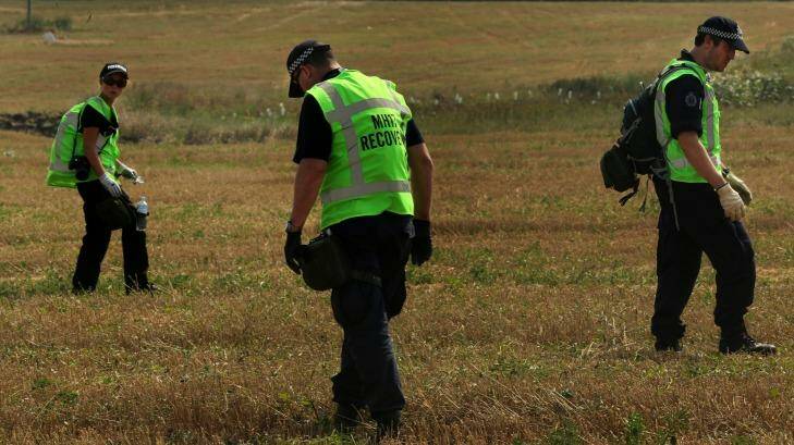 Searching for the truth: Investigators at the MH17 crash site. Photo: Kate Geraghty