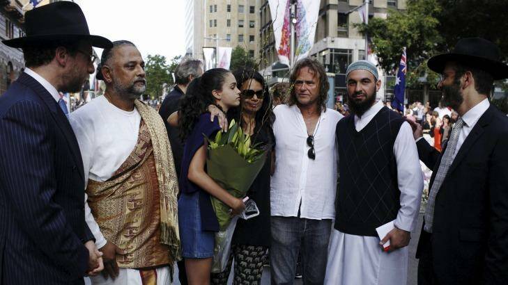 Tori Johnson's father, and sister (in blue) meeting religious leaders in Martin Place on Thursday. Photo: James Brickwood