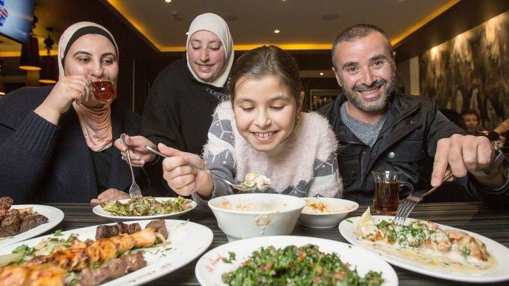 Hanadyi, Rouba, Dana and Ahmad dig into a Lebanese feast at Al Aseel Restaurant to break the fast during Ramadan. Photo: Cole Bennetts