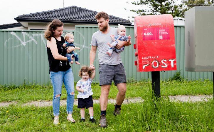 SH.  Holly and Liam Pender with Jemima: 2 and Twins: Adeline (kiwi fruits) Esther 7months.  Story about Aus post delivery guys who don't leave package as directed, leave 'not at home' card without even knocking. Photo by Edwina Pickles. Taken on 23rd March 2017. Photo: Edwina Pickles