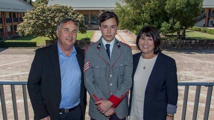Stuart Kelly, centre, with his parents Ralph and Kathy Kelly. Photo: The King's School