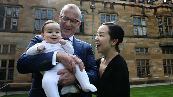University of Sydney Vice-Chancellor Michael Spence, with wife Jenny Ihn, wants baby Ted to have the same opportunities as other children. Photo: Louise Kennerley