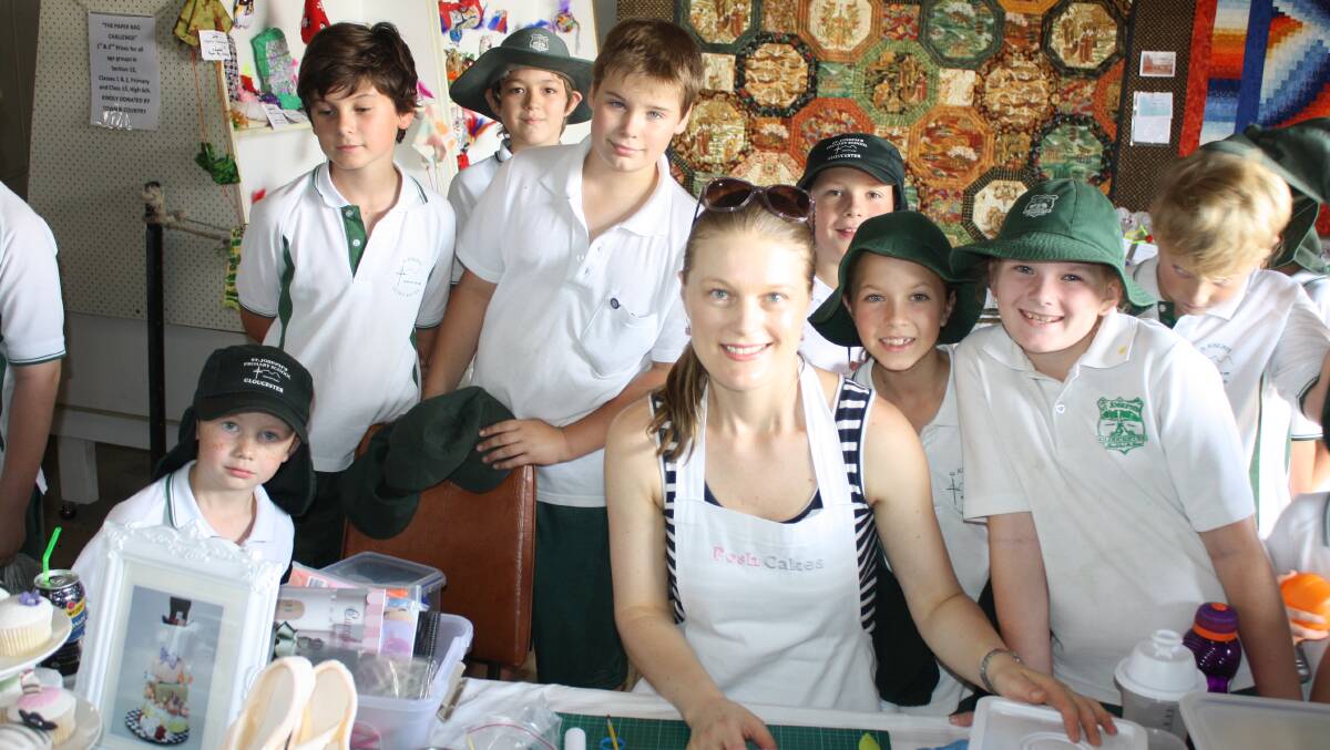 Students from St Joseph's Primary participate in a cake decorating demonstration.