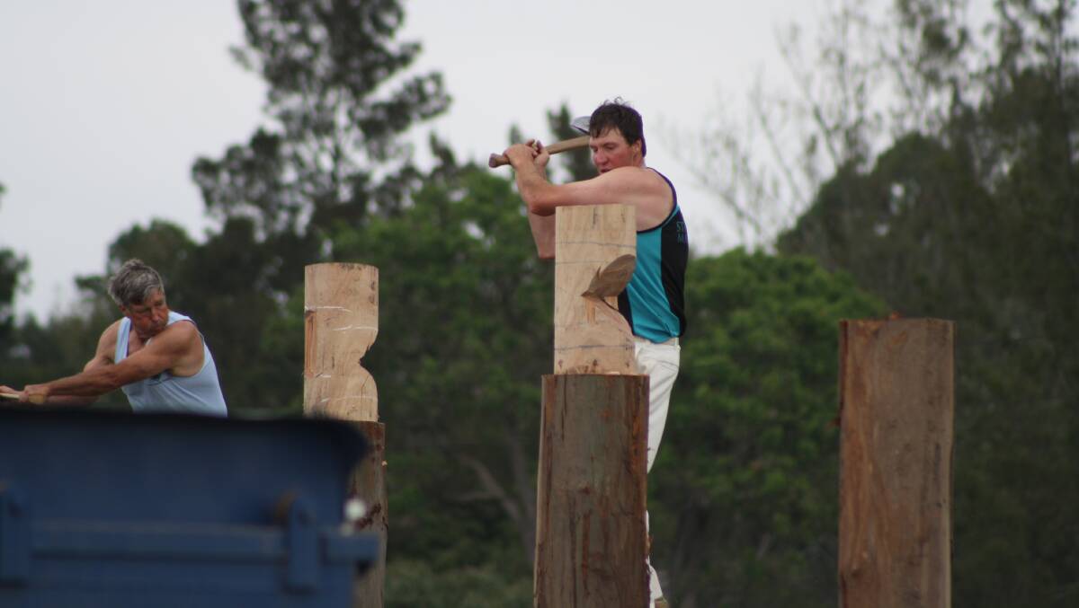 Michael Kellett competing in the woodchop. 
