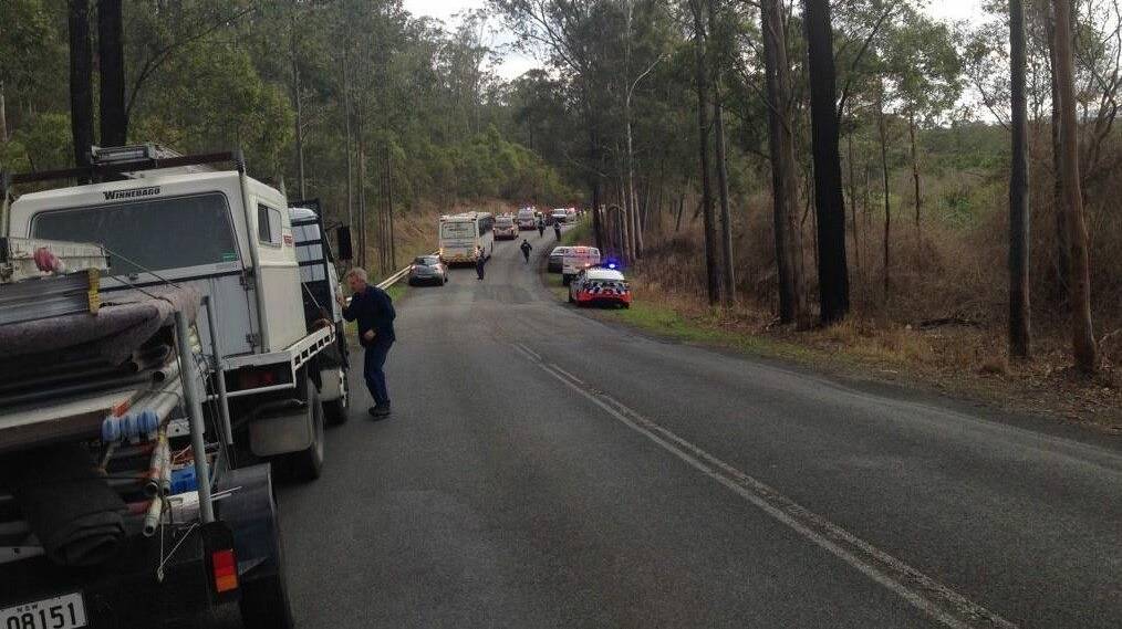 Traffic stopped on the Bucketts Way following last Friday’s crash. Pic Michael Lorigan.