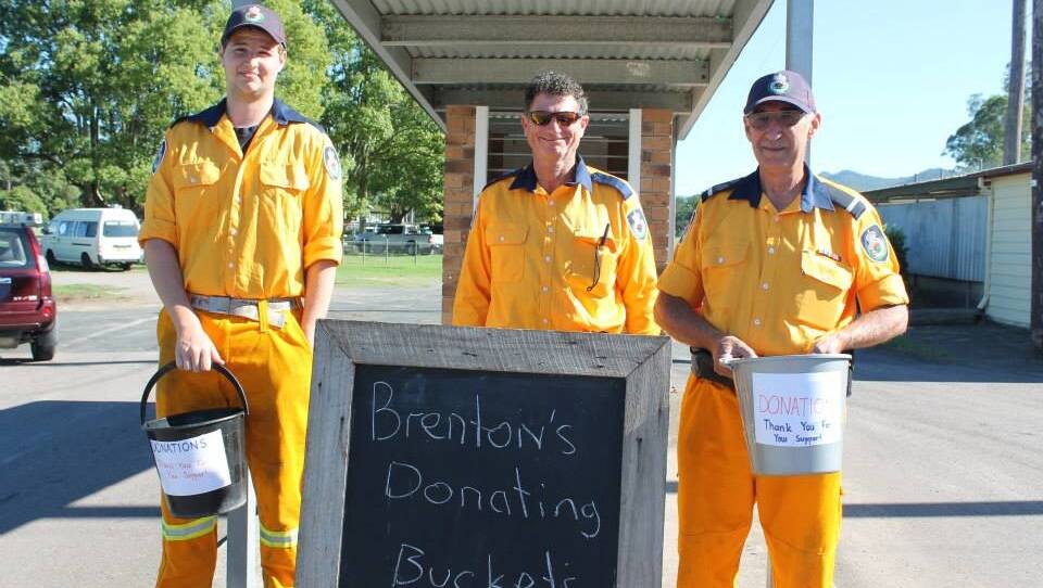 Rural Fire Service volunteers with donation buckets for Brenton.