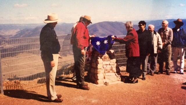 Mona unveiling the plaque at Carson's Pioneer Lookout.
