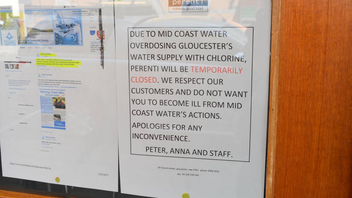 A sign out the front of Perenti yesterday after it was forced to close early due to the town's water supply being contaminated.