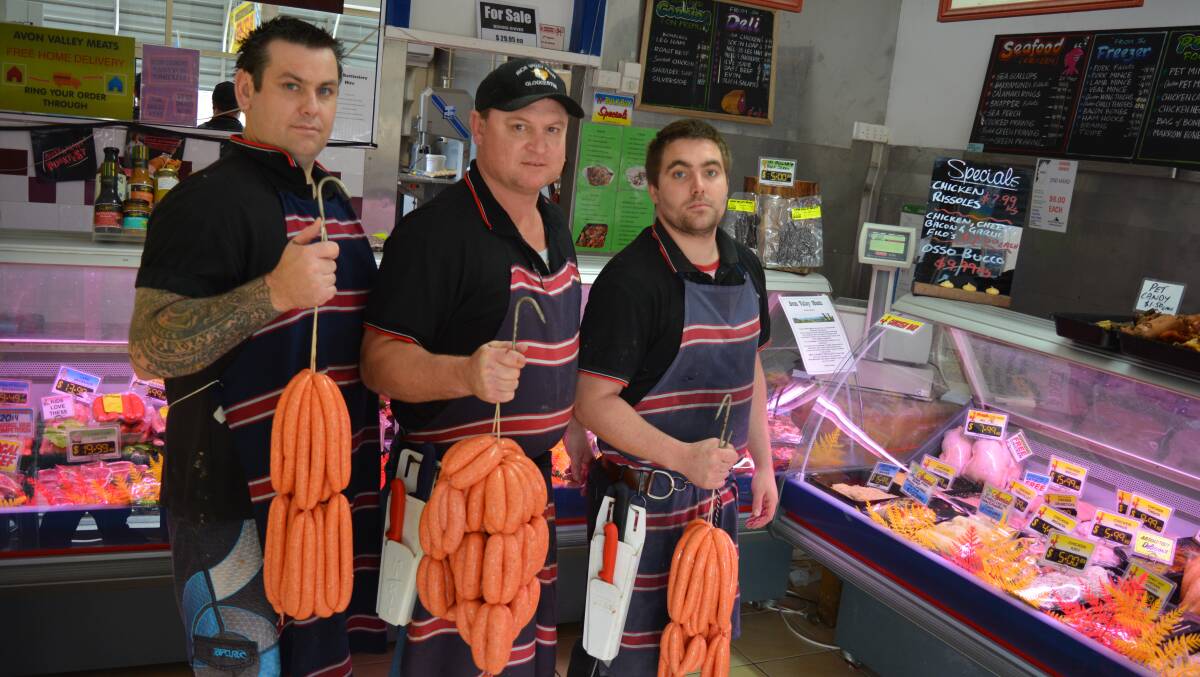 Mick Hendrickson, Dave Fraser and Ashlee Bourchier with some of their award-winning sausages.