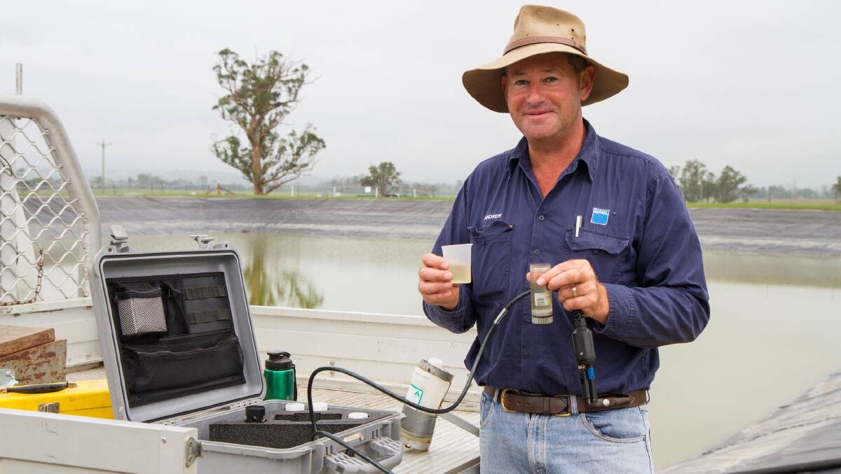 AGL's Andrew Lenehan carrying out water testing at the company's Tiedmans property. Groundswell Gloucester has hit out at AGL over an irrigation trial on the property using salty water from coal seam gas wells blended with fresh water.