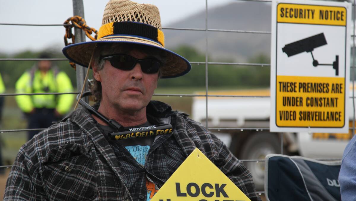 Brett Jacobs locked himself to the gate of a property where AGL plans to frack for coal seam gas.