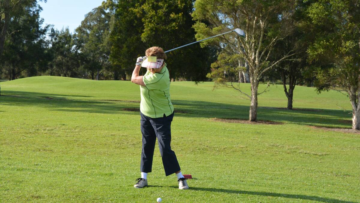 Tee’d off: Mary Moore shows her good form as she tees off.