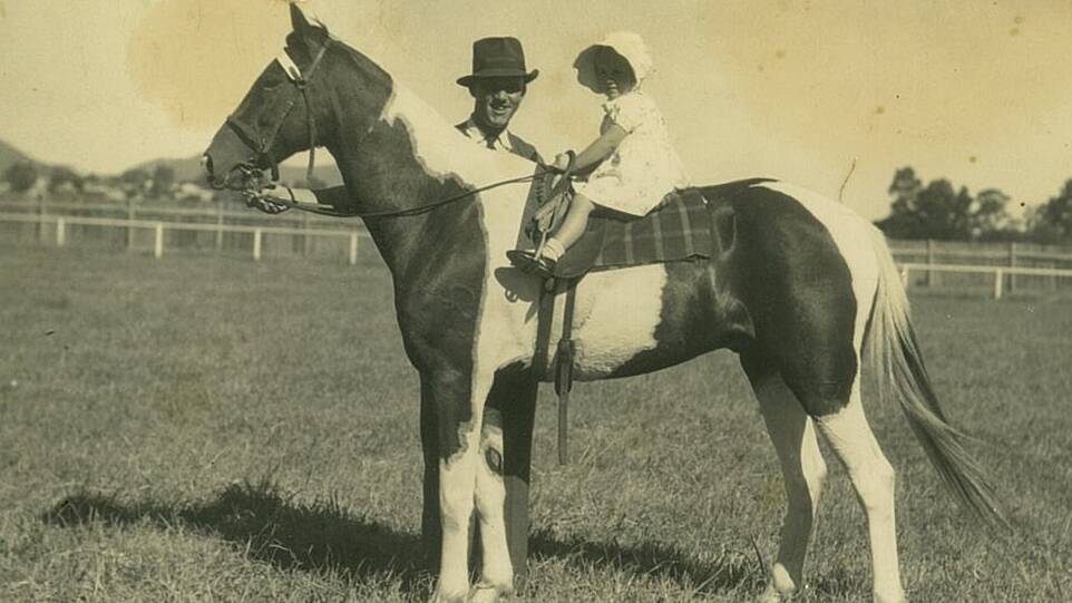Jeanette Carter, 2, riding 'Joe' with Archie White at the Gloucester Show. Circa 1940s.