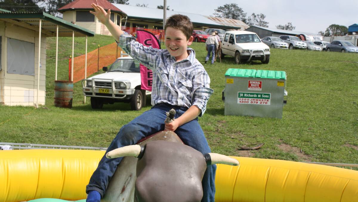 Travis Johnson gets to grips with the mechanical bull ride.
