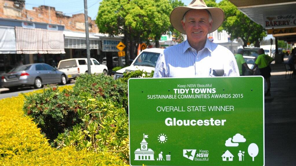 Positive note: Gloucester’s mayor John Rosenbaum proudly displays Gloucester’s new signs.