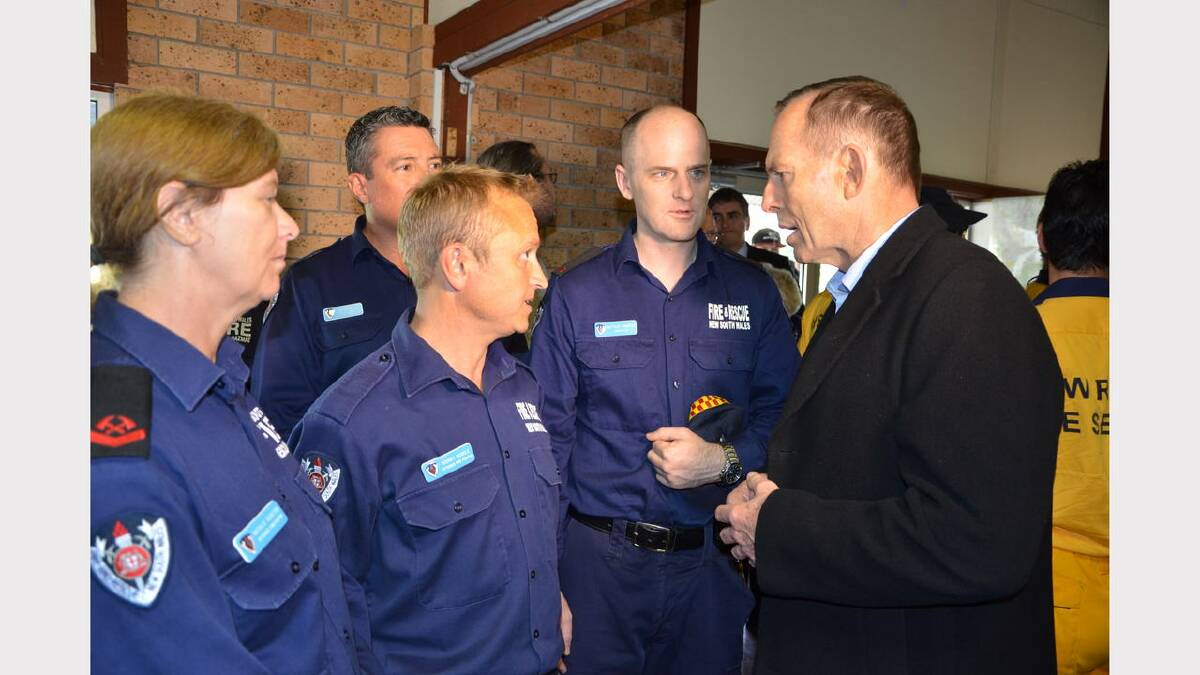 Mr Abbott (right) talking with Dungog Fire and Rescue NSW personnel Natalie Newton, Rodney Muddle and Matthew Thompson