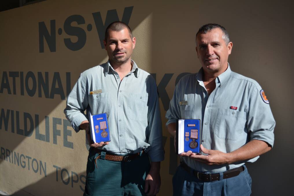 National Parks and Wildlife rangers Sean Thompson and Peter Beard were proud to be recently awarded their belated 15 years long service emergency work medals .