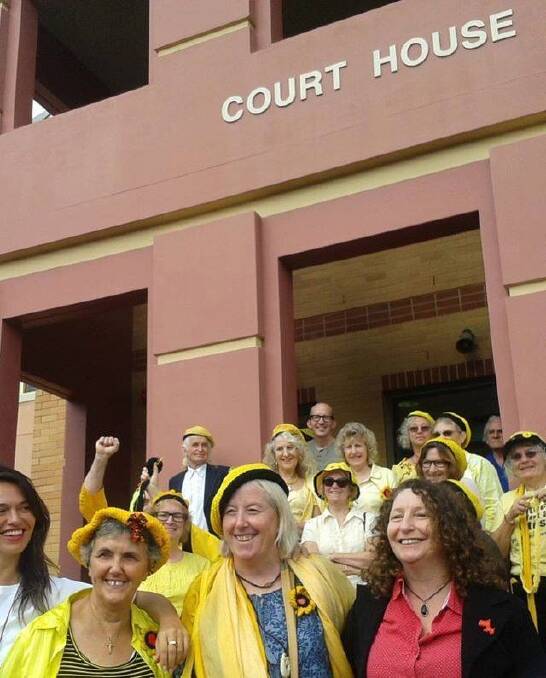 A happy Dominique Jacobs (centre) at the Lismore Local Court House.